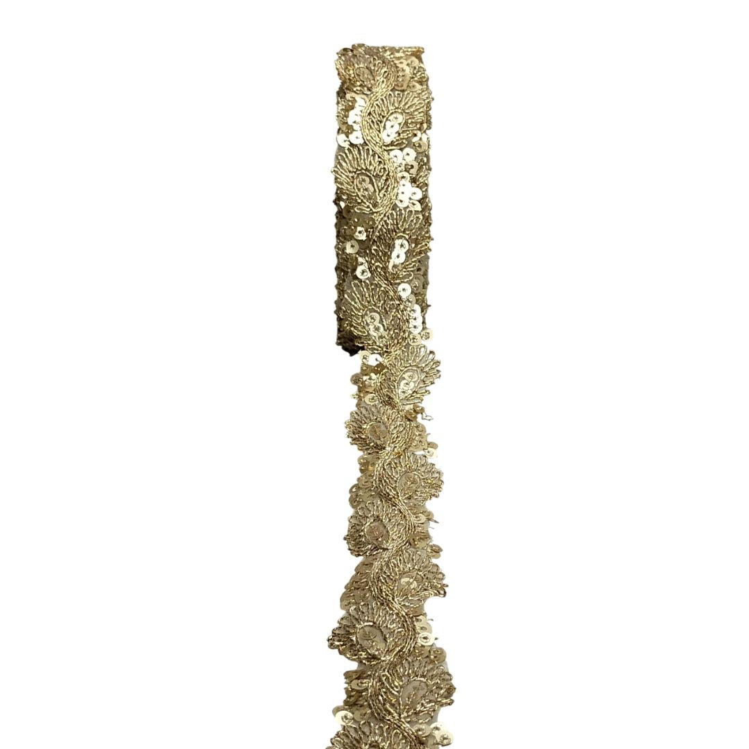 Gold decorative ribbon with intricate patterns on a white background